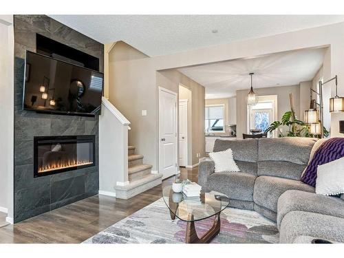 58 Livingston Gate Ne, Calgary, AB - Indoor Photo Showing Living Room With Fireplace