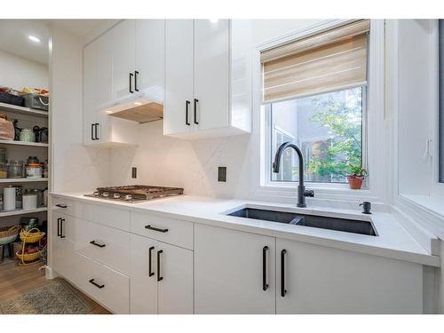 254 Discovery Ridge Way Sw, Calgary, AB - Indoor Photo Showing Kitchen With Double Sink With Upgraded Kitchen