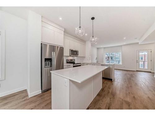 801-6 Merganser Drive West, Chestermere, AB - Indoor Photo Showing Kitchen With Stainless Steel Kitchen With Upgraded Kitchen