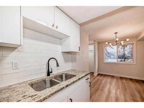 32-4531 7 Avenue Se, Calgary, AB - Indoor Photo Showing Kitchen With Double Sink