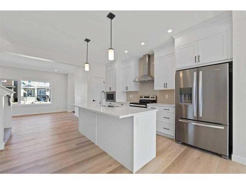 718 Bayview Hill Sw, Airdrie, AB - Indoor Photo Showing Kitchen With Upgraded Kitchen