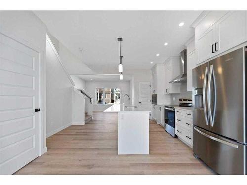 718 Bayview Hill Sw, Airdrie, AB - Indoor Photo Showing Kitchen With Upgraded Kitchen