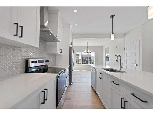 718 Bayview Hill Sw, Airdrie, AB - Indoor Photo Showing Kitchen With Double Sink With Upgraded Kitchen