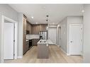 1410-111 Wolf Creek Drive Se, Calgary, AB  - Indoor Photo Showing Kitchen With Double Sink 