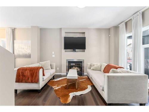 74 Walden Crescent Se, Calgary, AB - Indoor Photo Showing Living Room With Fireplace