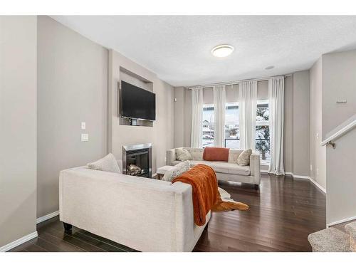 74 Walden Crescent Se, Calgary, AB - Indoor Photo Showing Living Room With Fireplace