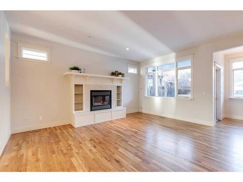 3714 8 Avenue Nw, Calgary, AB - Indoor Photo Showing Living Room With Fireplace