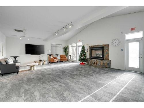 1407-24 Hemlock Crescent Sw, Calgary, AB - Indoor Photo Showing Living Room With Fireplace