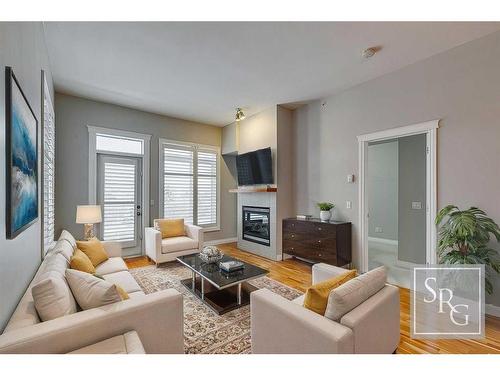 1407-24 Hemlock Crescent Sw, Calgary, AB - Indoor Photo Showing Living Room With Fireplace