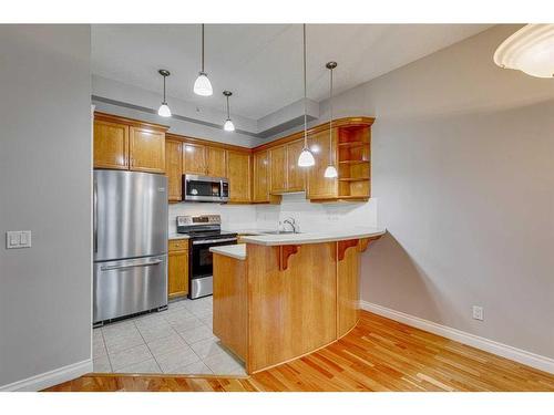 1407-24 Hemlock Crescent Sw, Calgary, AB - Indoor Photo Showing Kitchen With Stainless Steel Kitchen