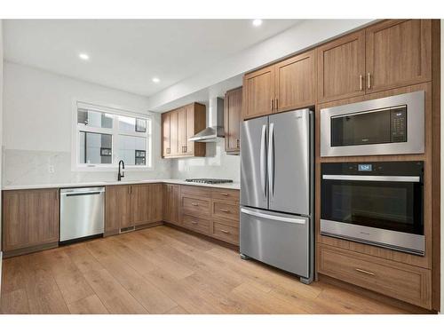 207-8235 8 Avenue Sw, Calgary, AB - Indoor Photo Showing Kitchen With Stainless Steel Kitchen