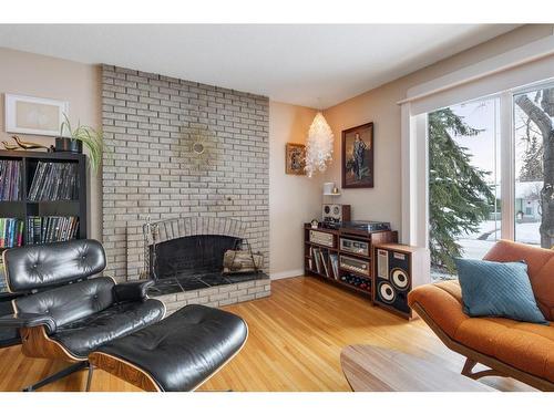 1132 Lake Sylvan Place Se, Calgary, AB - Indoor Photo Showing Living Room With Fireplace