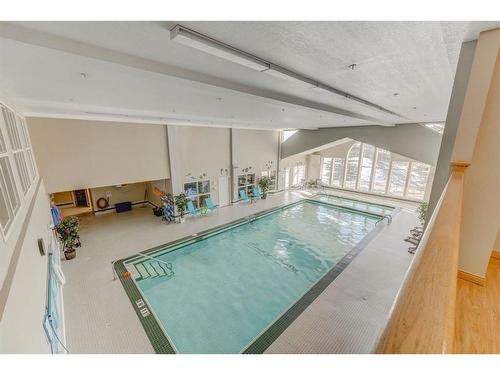 124-223 Tuscany Springs Boulevard Nw, Calgary, AB - Indoor Photo Showing Other Room With In Ground Pool