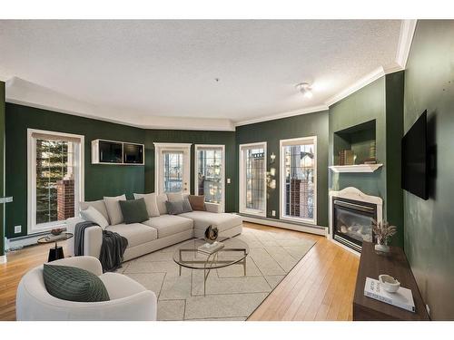 124-223 Tuscany Springs Boulevard Nw, Calgary, AB - Indoor Photo Showing Living Room With Fireplace