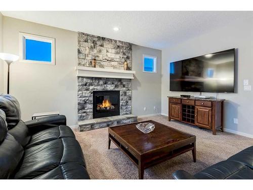 51 Auburn Glen Heights Se, Calgary, AB - Indoor Photo Showing Living Room With Fireplace