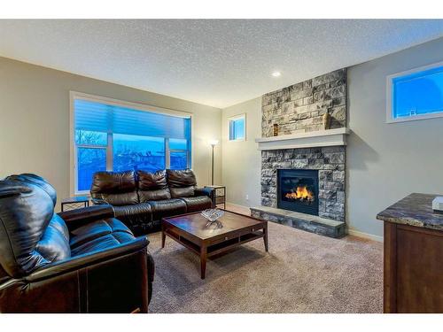 51 Auburn Glen Heights Se, Calgary, AB - Indoor Photo Showing Living Room With Fireplace