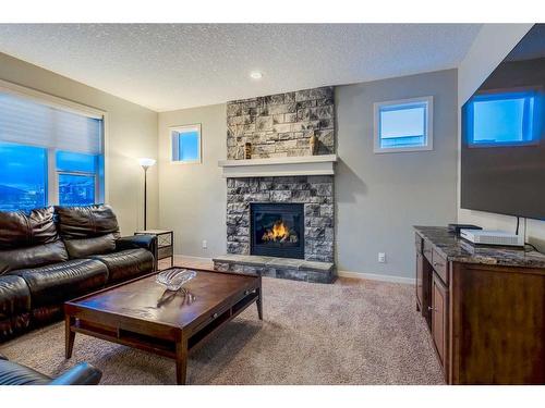 51 Auburn Glen Heights Se, Calgary, AB - Indoor Photo Showing Living Room With Fireplace