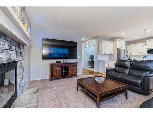 51 Auburn Glen Heights Se, Calgary, AB - Indoor Photo Showing Living Room With Fireplace