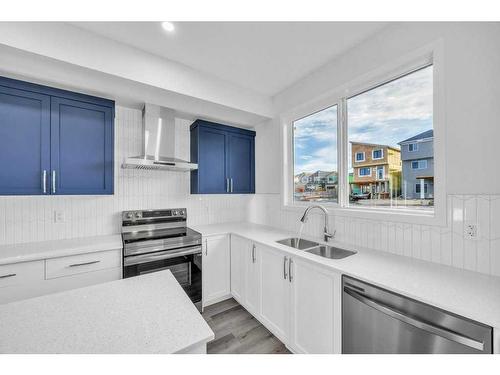 491 Tekarra Drive Nw, Calgary, AB - Indoor Photo Showing Kitchen With Stainless Steel Kitchen With Double Sink