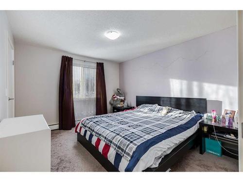 211-4455A Greenview Drive Ne, Calgary, AB - Indoor Photo Showing Bedroom