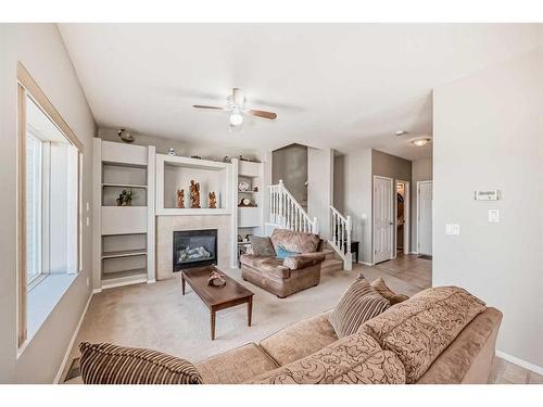 703-720 Willowbrook Road Nw, Airdrie, AB - Indoor Photo Showing Living Room With Fireplace