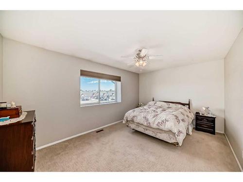 703-720 Willowbrook Road Nw, Airdrie, AB - Indoor Photo Showing Bedroom