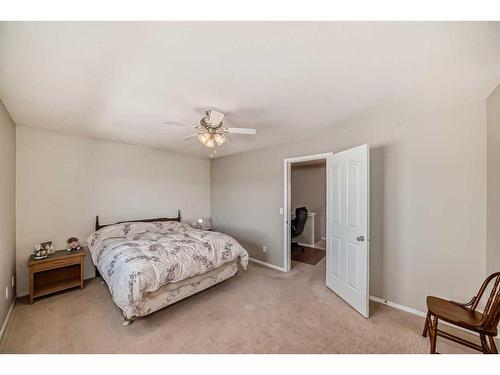 703-720 Willowbrook Road Nw, Airdrie, AB - Indoor Photo Showing Bedroom