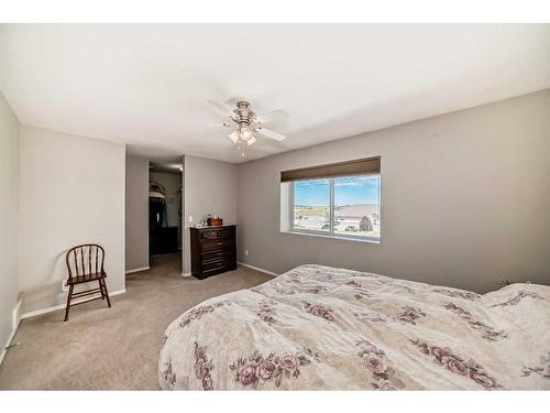 703-720 Willowbrook Road Nw, Airdrie, AB - Indoor Photo Showing Bedroom