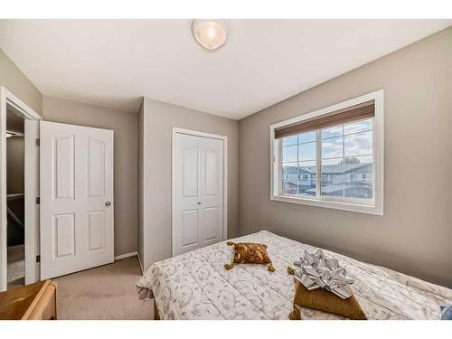 703-720 Willowbrook Road Nw, Airdrie, AB - Indoor Photo Showing Bedroom