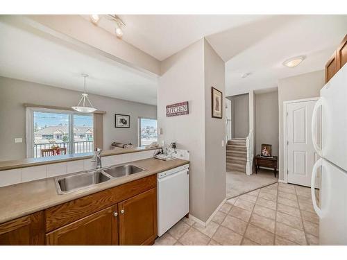 703-720 Willowbrook Road Nw, Airdrie, AB - Indoor Photo Showing Kitchen With Double Sink