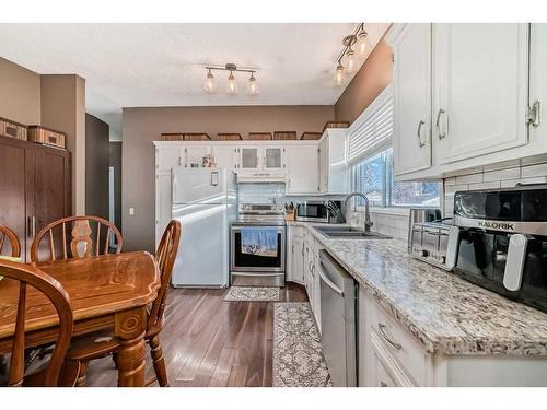 35 Lake Sylvan Close Se, Calgary, AB - Indoor Photo Showing Kitchen With Double Sink