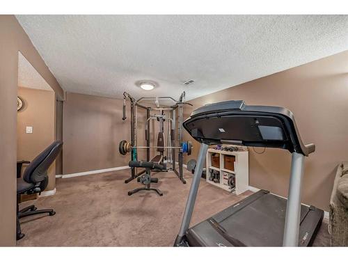 35 Lake Sylvan Close Se, Calgary, AB - Indoor Photo Showing Gym Room