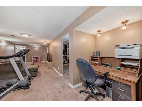 35 Lake Sylvan Close Se, Calgary, AB - Indoor Photo Showing Gym Room