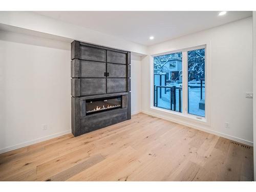 1406 22 Avenue Nw, Calgary, AB - Indoor Photo Showing Other Room With Fireplace