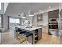 25 Snowberry Lane East, Okotoks, AB  - Indoor Photo Showing Kitchen With Stainless Steel Kitchen With Upgraded Kitchen 