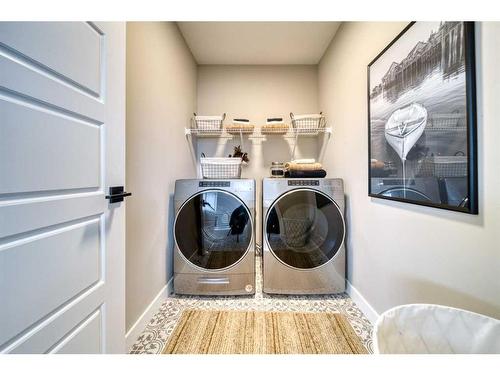 68 Dawson Wharf Mount, Chestermere, AB - Indoor Photo Showing Laundry Room