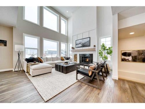 68 Dawson Wharf Mount, Chestermere, AB - Indoor Photo Showing Living Room With Fireplace