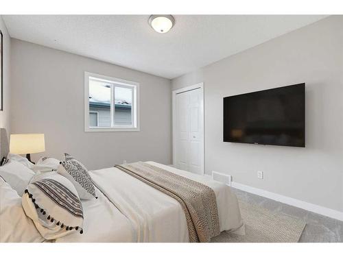 46 Chapman Close Se, Calgary, AB - Indoor Photo Showing Bedroom