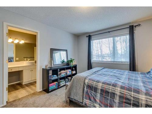 559 Douglas Glen Boulevard Se, Calgary, AB - Indoor Photo Showing Bedroom