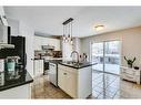 559 Douglas Glen Boulevard Se, Calgary, AB  - Indoor Photo Showing Kitchen With Double Sink 