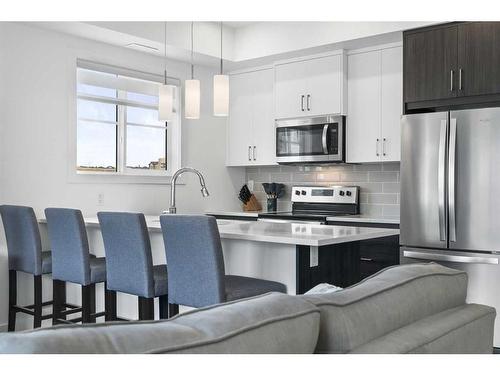 36 Spring Creek Common Sw, Calgary, AB - Indoor Photo Showing Kitchen With Stainless Steel Kitchen With Upgraded Kitchen