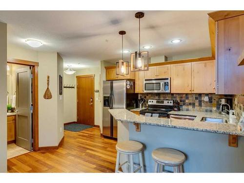 302-1002 8 Avenue, Canmore, AB - Indoor Photo Showing Kitchen With Double Sink With Upgraded Kitchen