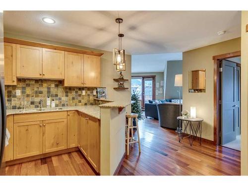 302-1002 8 Avenue, Canmore, AB - Indoor Photo Showing Kitchen With Double Sink