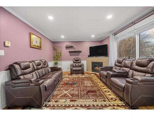 344-4525 31 Street Sw, Calgary, AB - Indoor Photo Showing Living Room With Fireplace