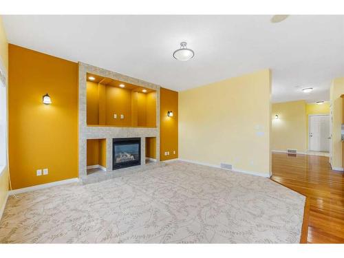 277 Martin Crossing Place Ne, Calgary, AB - Indoor Photo Showing Living Room With Fireplace