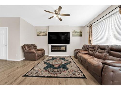 113 Cityline Square Ne, Calgary, AB - Indoor Photo Showing Living Room With Fireplace