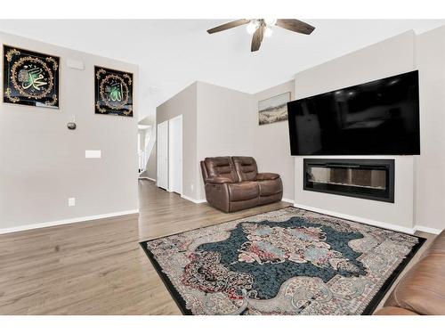 113 Cityline Square Ne, Calgary, AB - Indoor Photo Showing Living Room With Fireplace