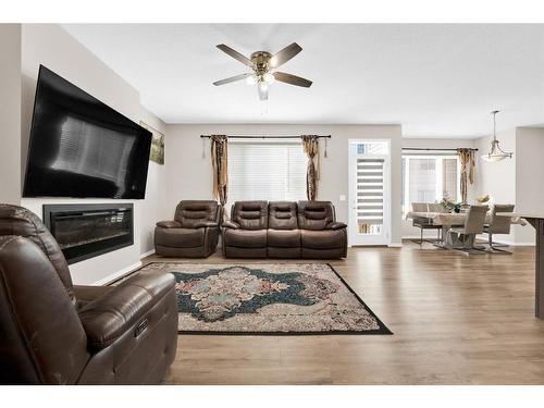 113 Cityline Square Ne, Calgary, AB - Indoor Photo Showing Living Room With Fireplace