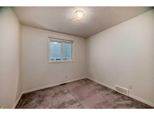 67 Sundown Terrace, Cochrane, AB - Indoor Photo Showing Other Room