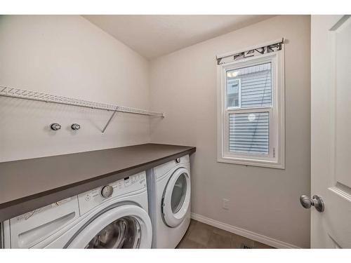 67 Sundown Terrace, Cochrane, AB - Indoor Photo Showing Laundry Room